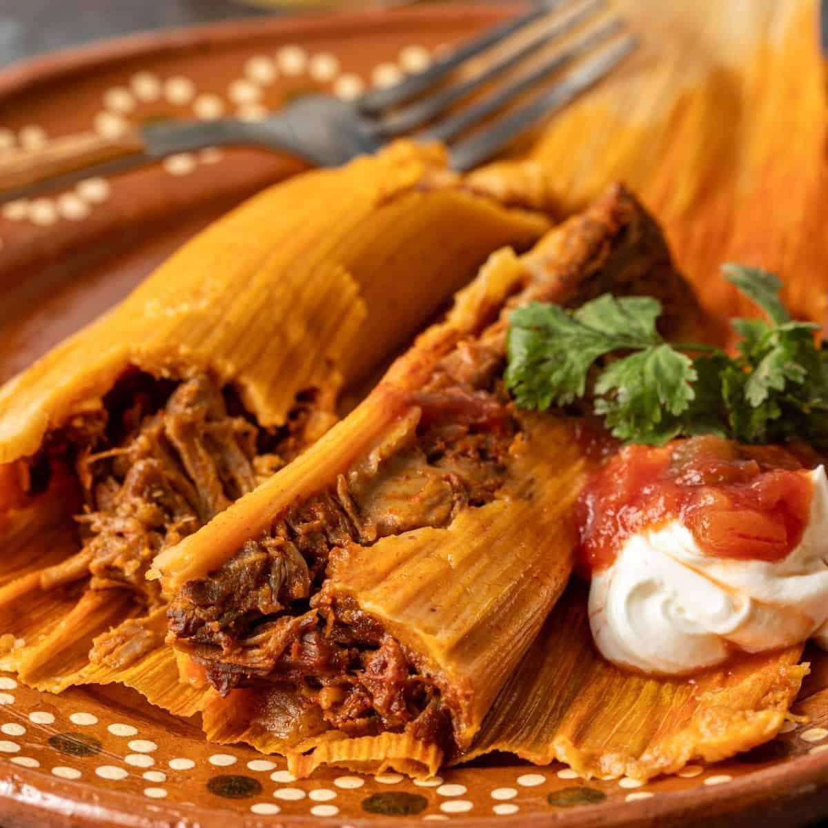 Pork tamales in red salsa